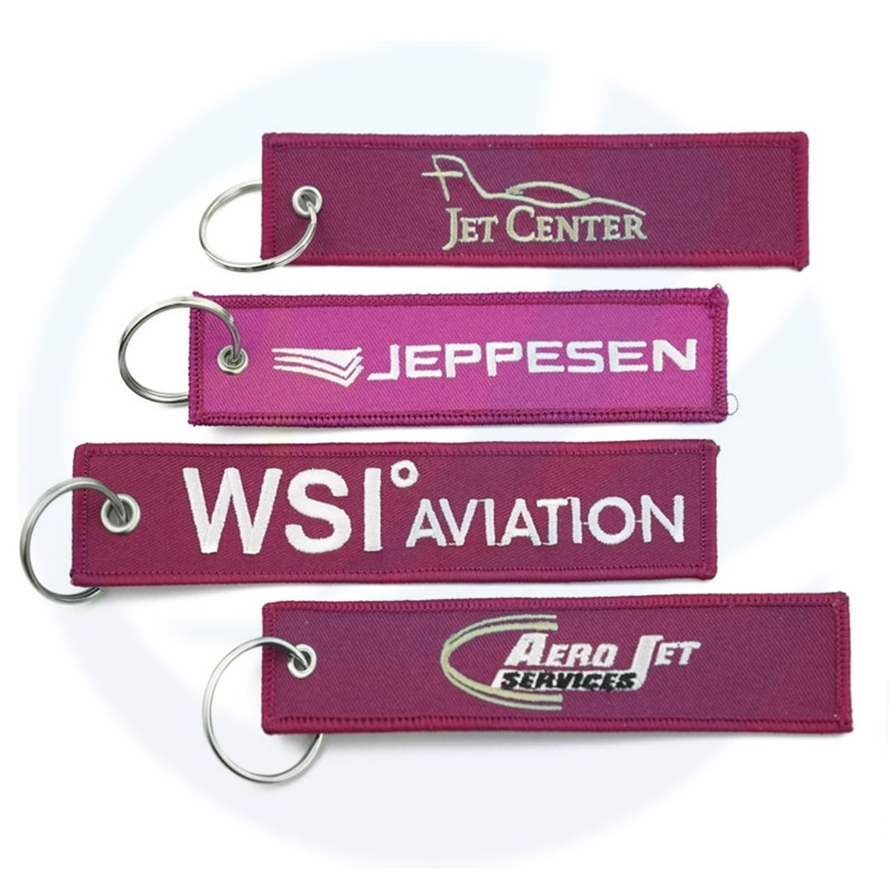 Wholesale Flight Custom Jet Tag Key Chains Fabric Woven Brand Label Woven Custom Logo Key Tag Embroidered Key Ring